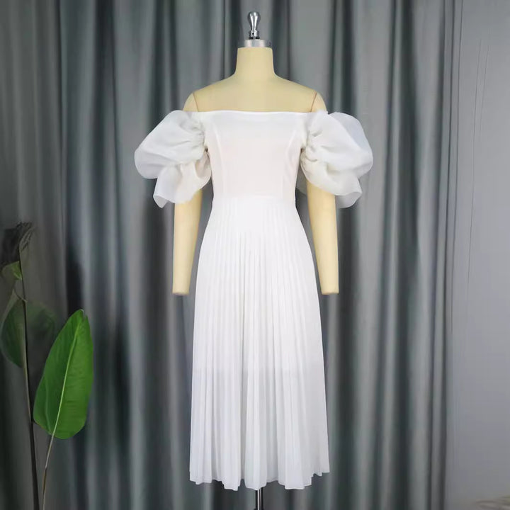 Dame Elegant klänning med voluminösa puffärmar och svängande kjol Mirla-Eva Jonsson