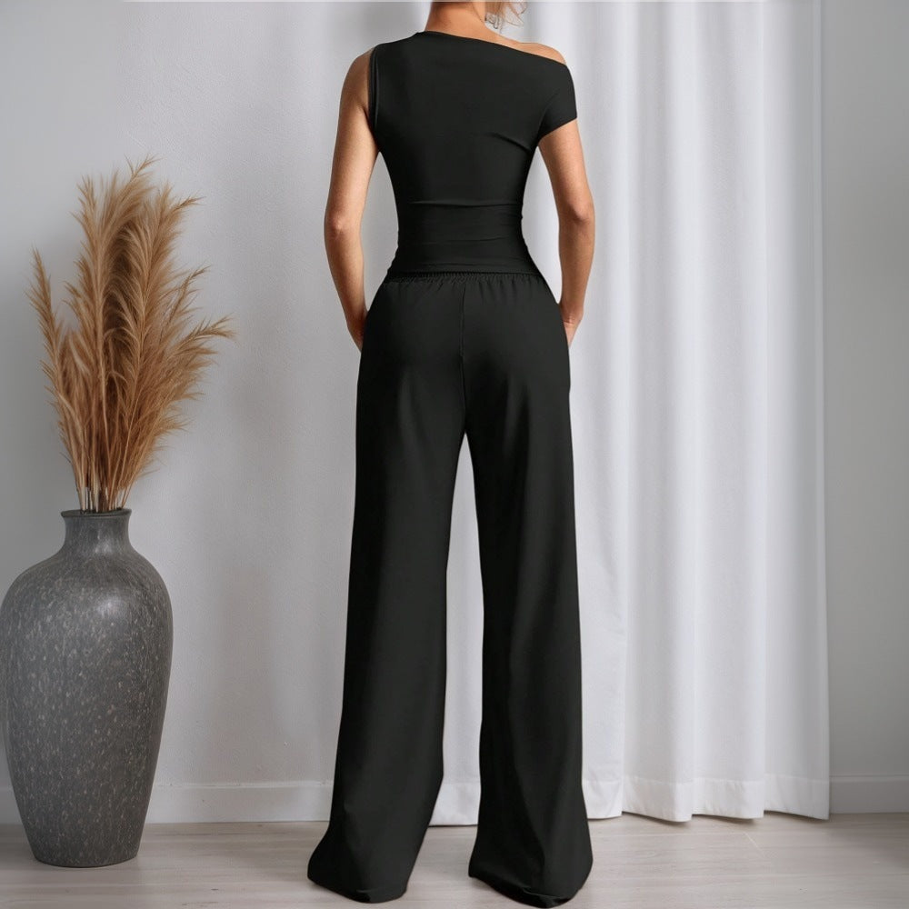 Stilig kvinnors jumpsuit med asymmetrisk design och fickor Mirla-Eva Jonsson