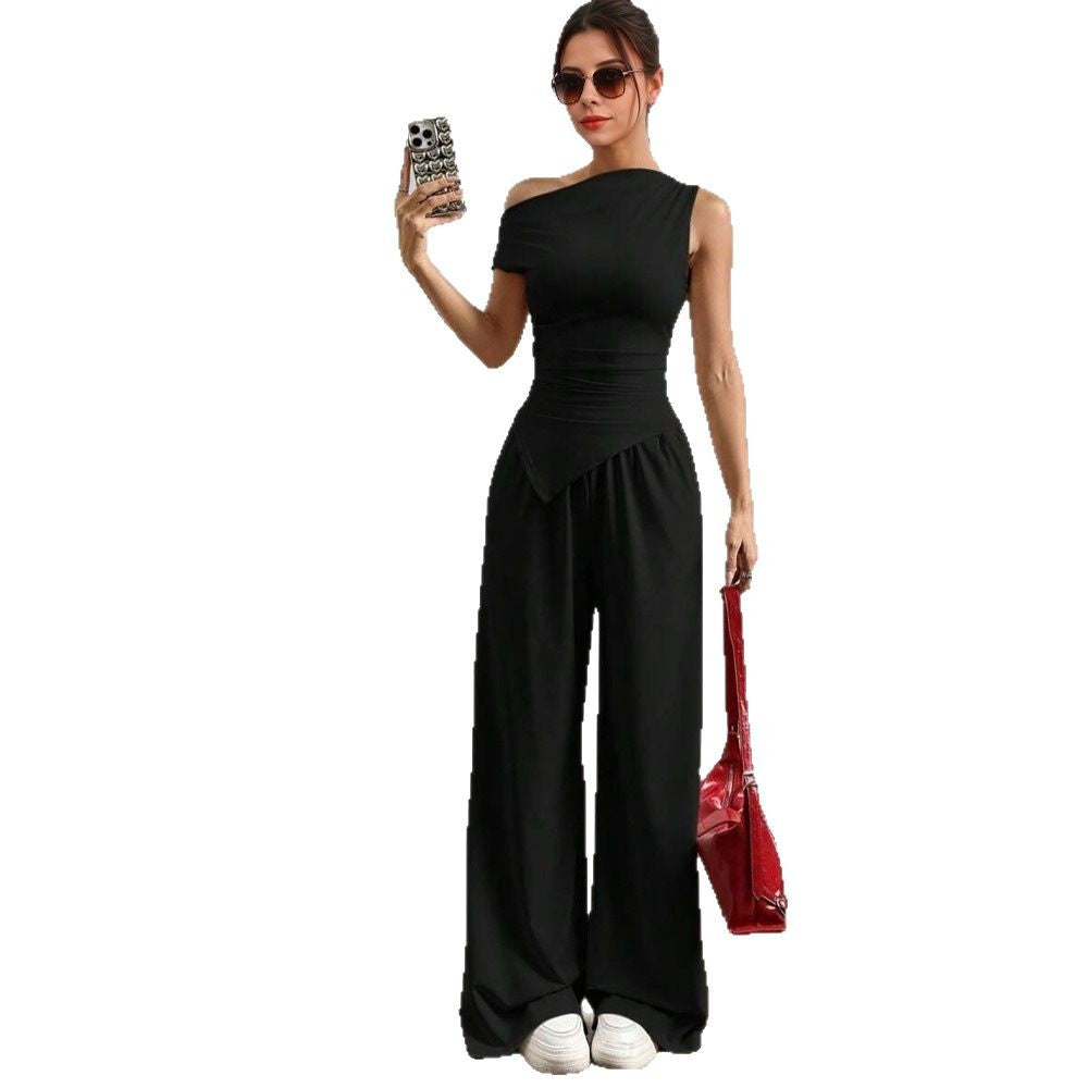 Stilig kvinnors jumpsuit med asymmetrisk design och fickor Mirla-Eva Jonsson